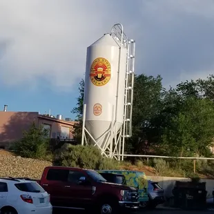 a large silo in the background