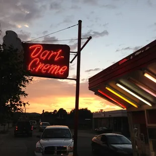 a neon sign for dari creme