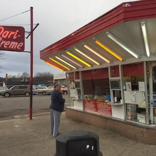 a man standing in front of the store