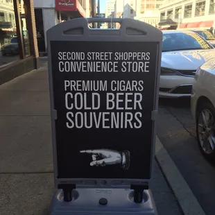 a sign on a sidewalk