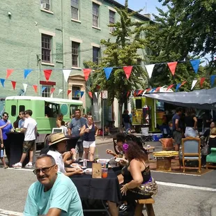 food trucks and seating in the shade.#secondsundayonmain