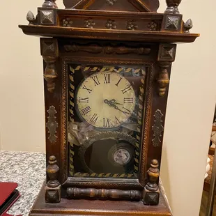 Antique clock that was in a box without having been wrapped or secured in any way. Broken.