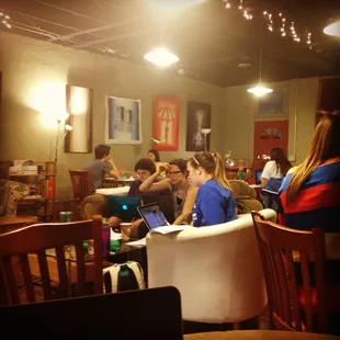 a group of people sitting in a restaurant