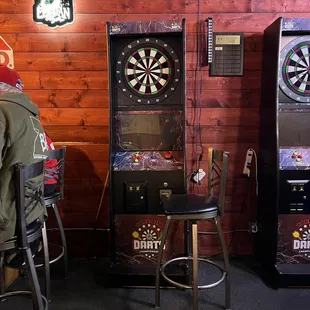 a man playing a game of darts