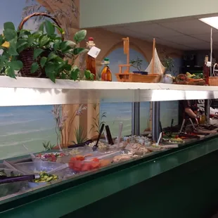 two women standing in front of a buffet