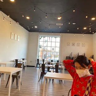 a woman wearing a face mask in a restaurant