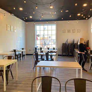a dining room with tables and chairs
