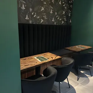 two chairs and a table in a corner