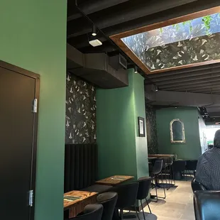 a man sitting at a table in a restaurant