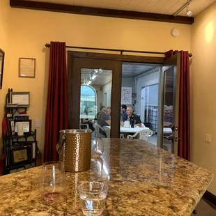 Tasting room bar looking at a private room for additional tasting areas