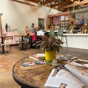 people sitting at tables in a restaurant
