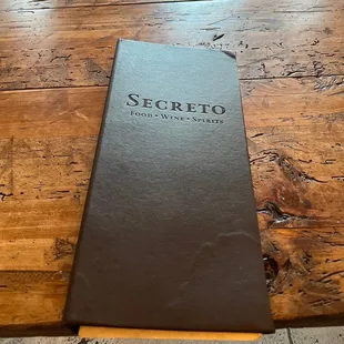 a menu on a wooden table