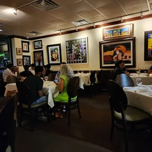 a group of people sitting at tables