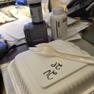 Container on their messy counter.