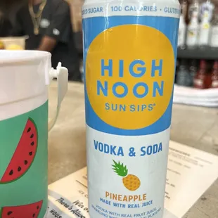 a can of vodka and a can of pineapple