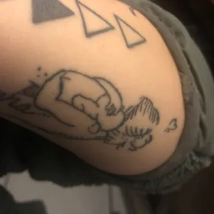 The hand in the tattoo is messed up