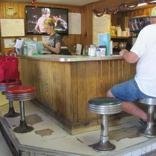 a man sitting at the counter