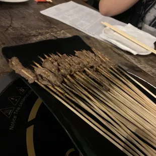 a plate of skewered food