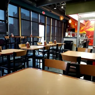 a restaurant with tables and chairs