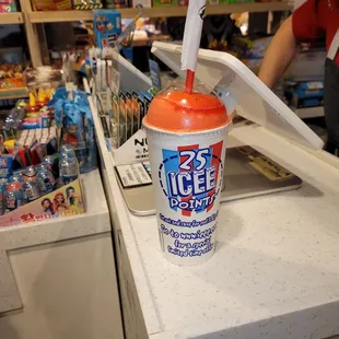 a cup of soda on a counter
