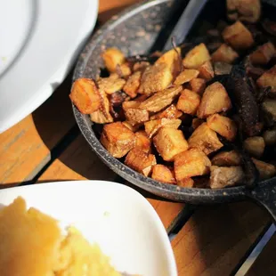 a pan of potatoes and a skillet