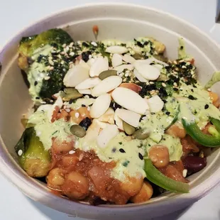 Sprout Bowl: Brown Rice, Brussel Sprouts, Power Beans, Kale Avocado, sesame seeds, seaweed flakes, and Almond slices