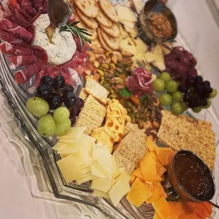 a platter of cheese and crackers