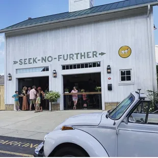 ows people standing in front of the building