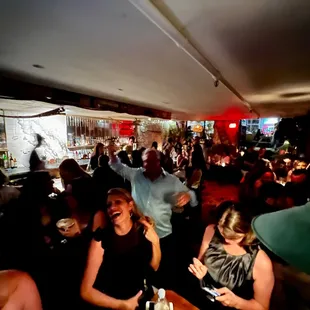 a crowd of people at a bar