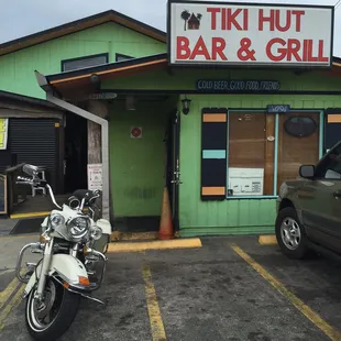 a motorcycle parked in front of a restaurant