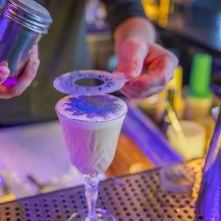 a bartender making a drink