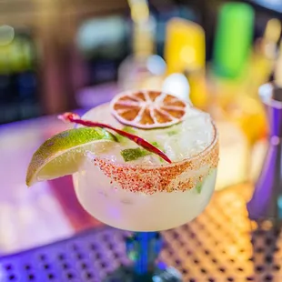 a margarita with a lime garnish