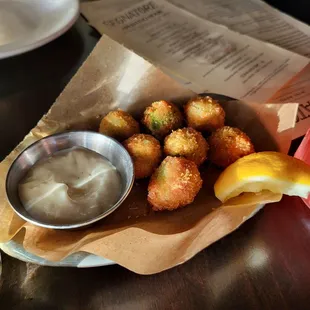 Fried olives stuffed with sausage. Would eat a million of these with 3 beers while watching football and consider my life complete.