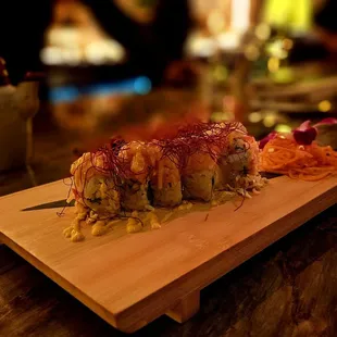 a sushi on a cutting board