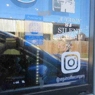 a reflection of a car in a window