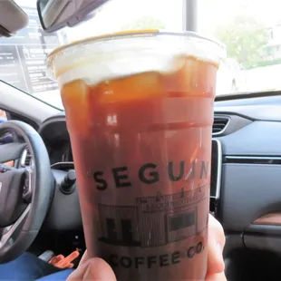 a person holding a cup of coffee