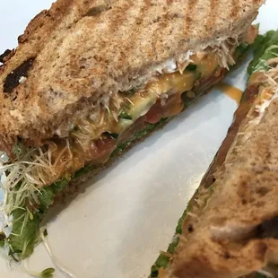 Delicious vegetable sandwich with cream cheese, sweet sauce, and on raisin bread