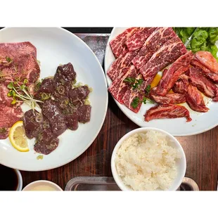 ows a plate of meat and rice