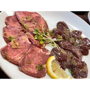 ows a plate of meat and vegetables