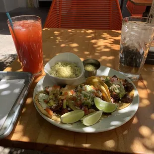 Tacos Grande platter with birria, steak, and pork tacos