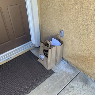 Meals in paper bags on the floor.