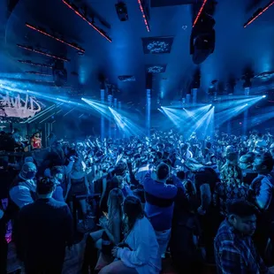 a large crowd of people at a nightclub