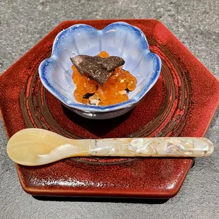 Salmon roe over rice topped with black truffle