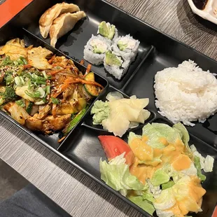 a bento box with a variety of food items