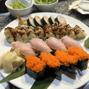 Smelt Roe nigiri. Seared Albacore nigiri. Volcano roll. Hurricane roll. Edamame