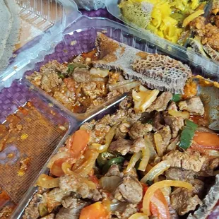 Vegetarian combo and lamb tibs. The "honeycomb" injera is worth it by itself!! (This was after 3 of us ate from it.) Large portions.