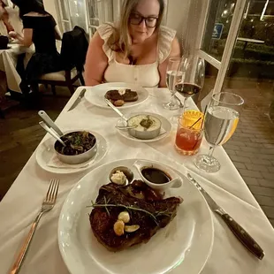 Meal: 45 day dry aged ribeye, wild mushrooms, Parmesan risotto, ribeye. Drink: dragon berry mocktail (delicious) &amp; the cheapest glass of red