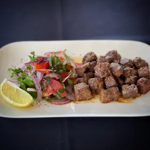 a plate of meat and vegetables