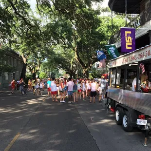 a crowd of people standing in line
