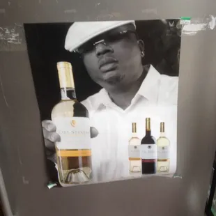 a man holding a bottle of wine